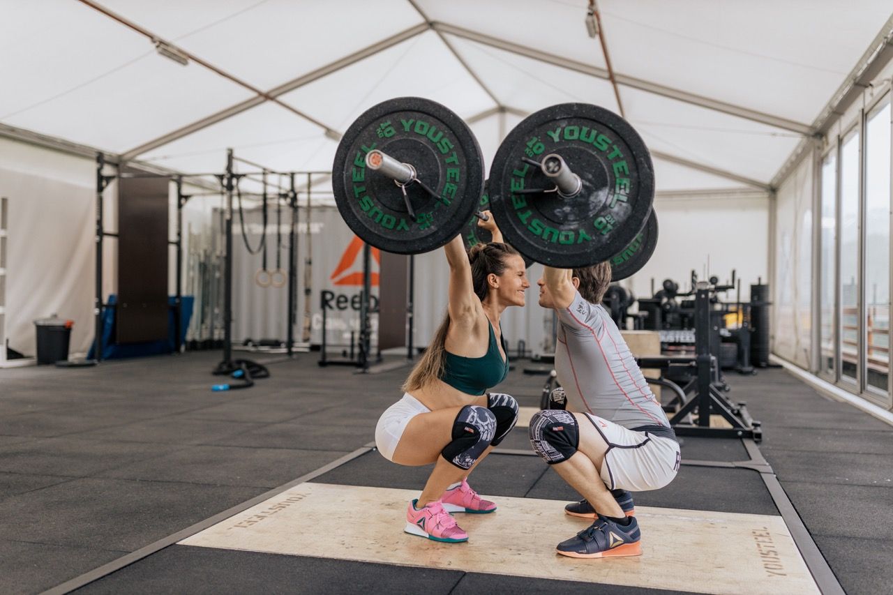 Photo by  Anastasia  Shuraeva: https://www.pexels.com/photo/couple-facing-each-other-while-lifting-barbells-4944979/