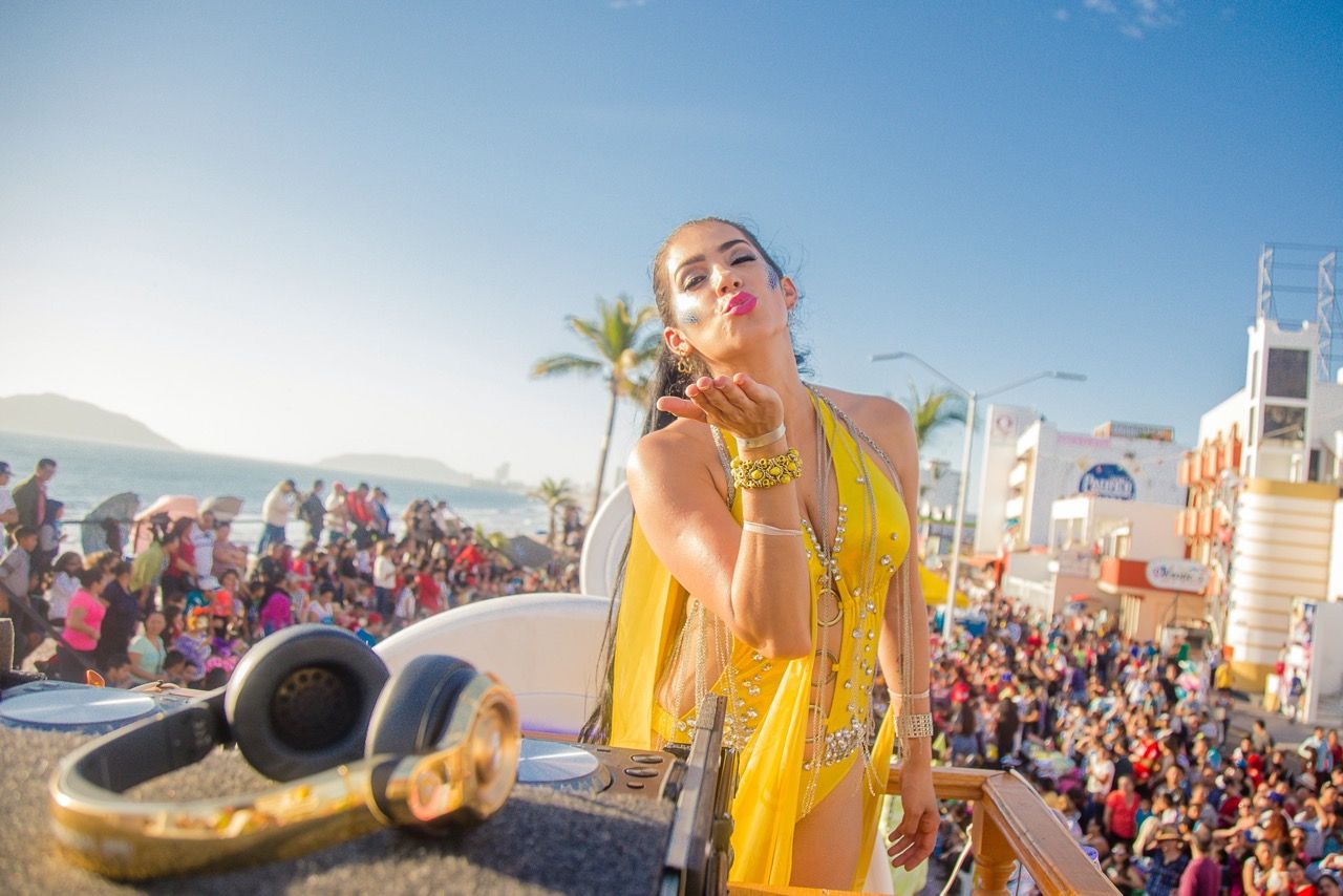 Photo by HELEN JOVANOVICH: https://www.pexels.com/photo/woman-in-yellow-swimwear-blowing-a-kiss-8910180/