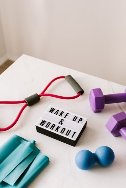 Photo by Karolina Grabowska: https://www.pexels.com/photo/wake-up-and-workout-slogan-on-light-box-among-sports-equipment-4397840/