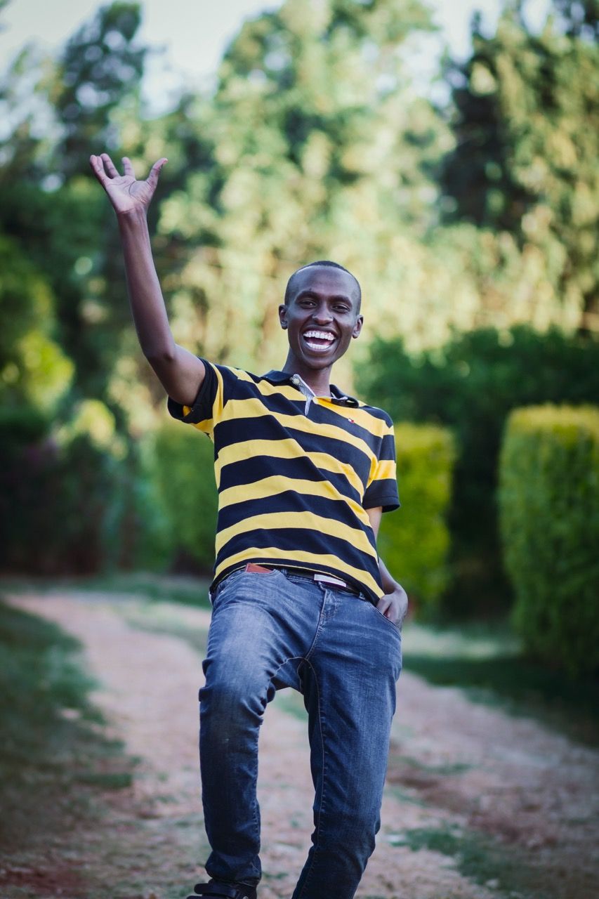 Photo by Nicholas  Githiri: https://www.pexels.com/photo/man-in-striped-shirt-waving-1035835/