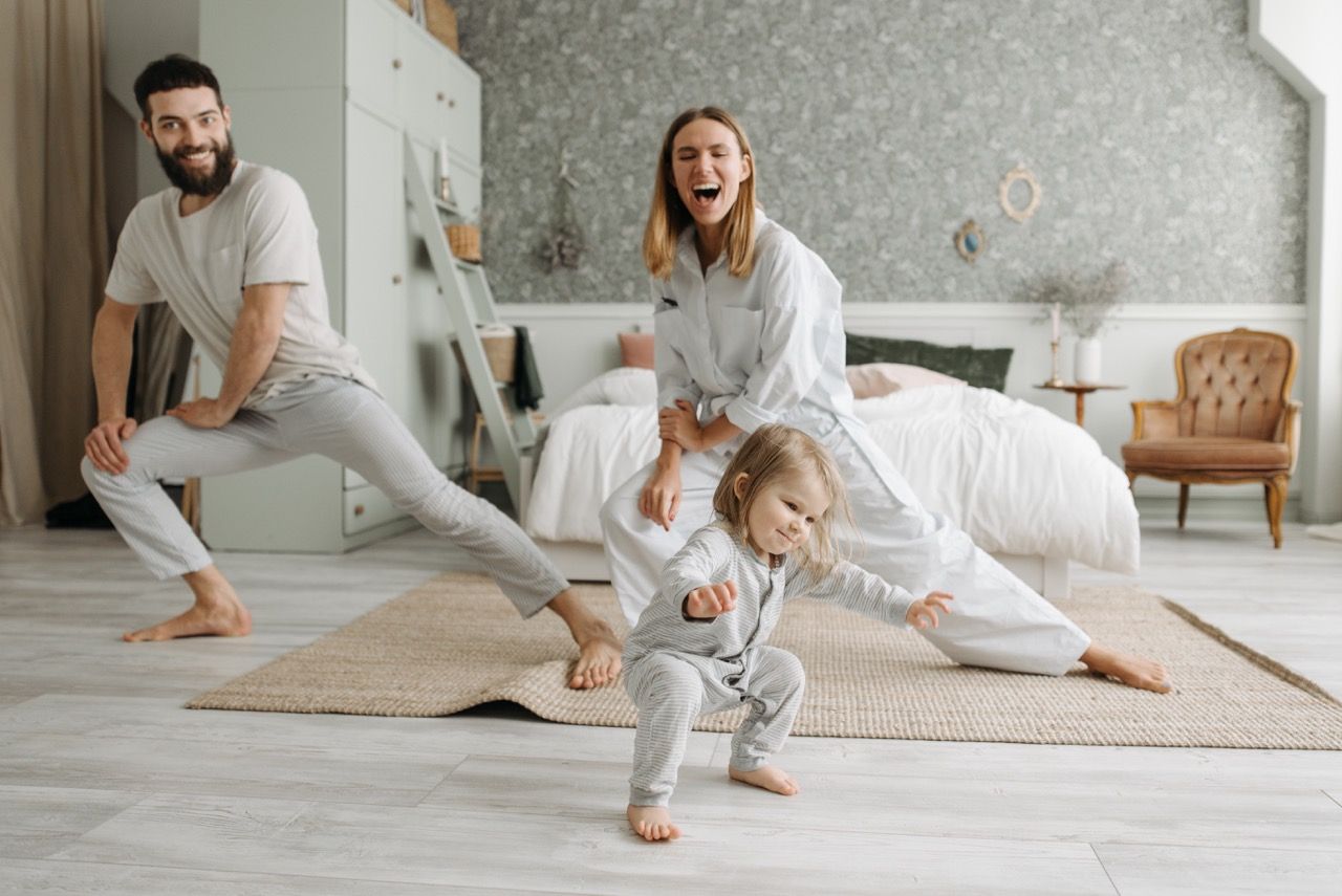 Photo by Pavel Danilyuk: https://www.pexels.com/photo/a-couple-stretching-their-legs-while-looking-at-their-cute-daughter-7220529/