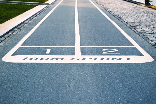 Photo by Tim Gouw: https://www.pexels.com/photo/blue-concrete-pavement-with-100m-sprint-paint-60230/