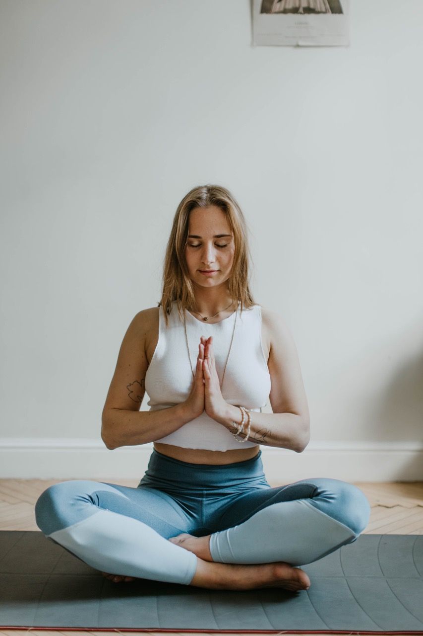 Photo by Valeria Ushakova: https://www.pexels.com/photo/woman-doing-yoga-inside-a-room-3094215/