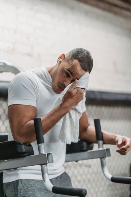 Photo by Julia Larson : https://www.pexels.com/photo/strong-black-man-wiping-forehead-with-towel-in-gym-6455950/