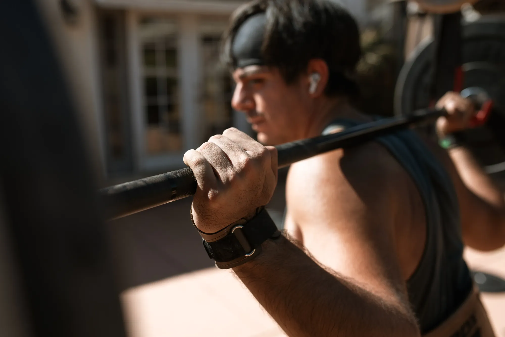 Man with barbell on his back